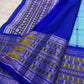 Threadwork roundel motif on the aqua body.