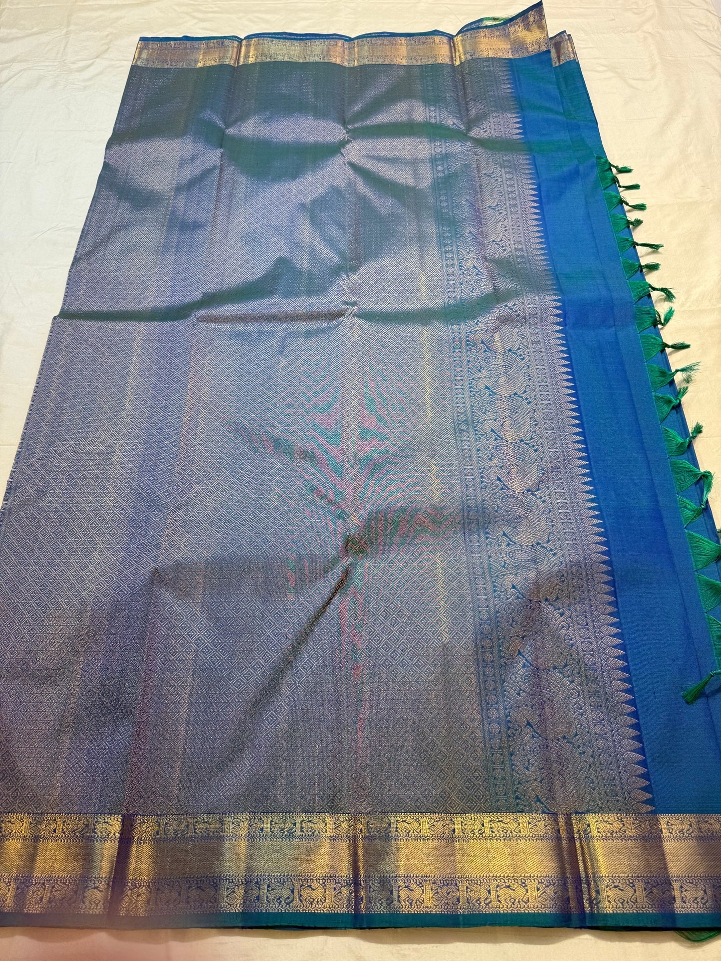 Peacock blue handwoven pure silk KanchiPattu saree — full saree view with Butta motifs — Idam Living