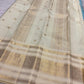 Close view of Aqua Blue Kanchipuram silk showing the zari checked structure and petite woven buttas.