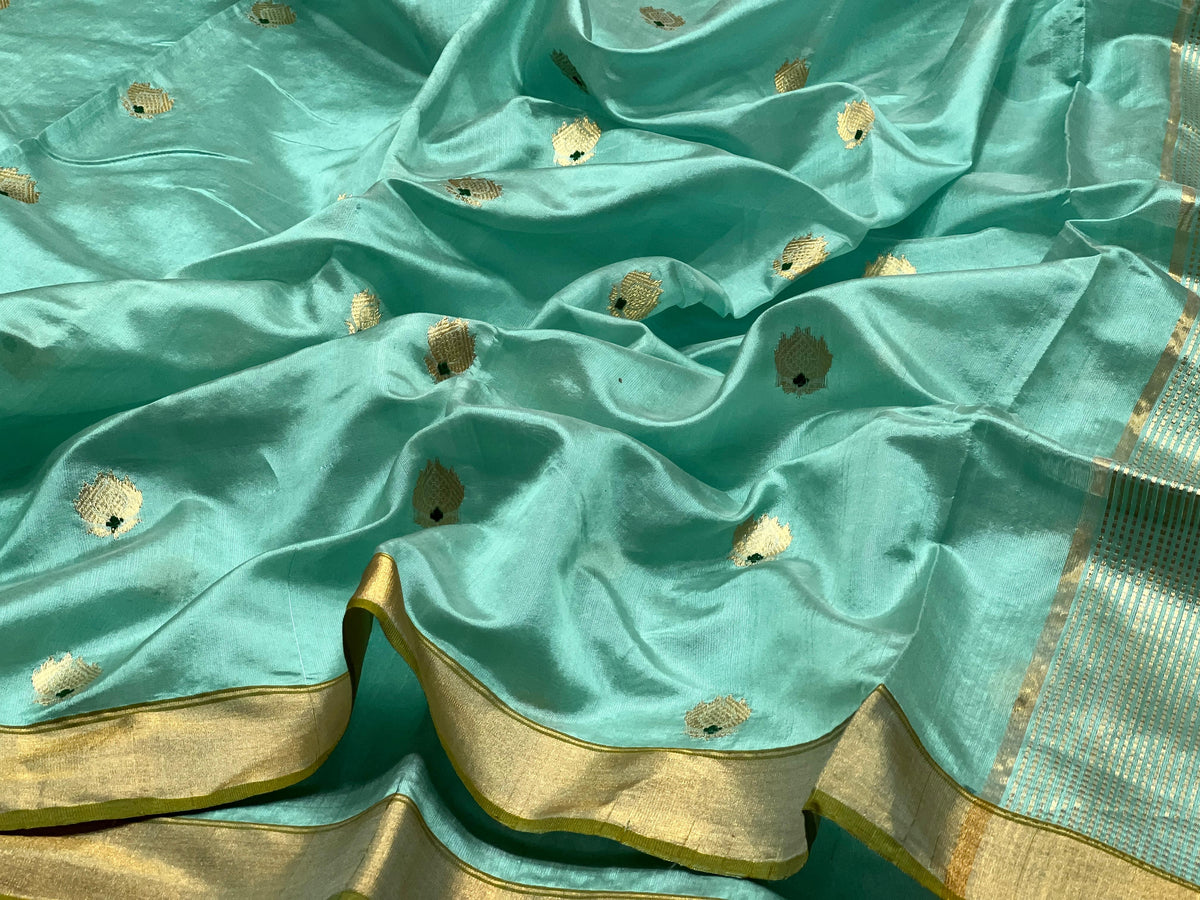 Aqua Blue Katan Silk Chanderi saree with petite gold buttas, green accents and gold border with olive edging