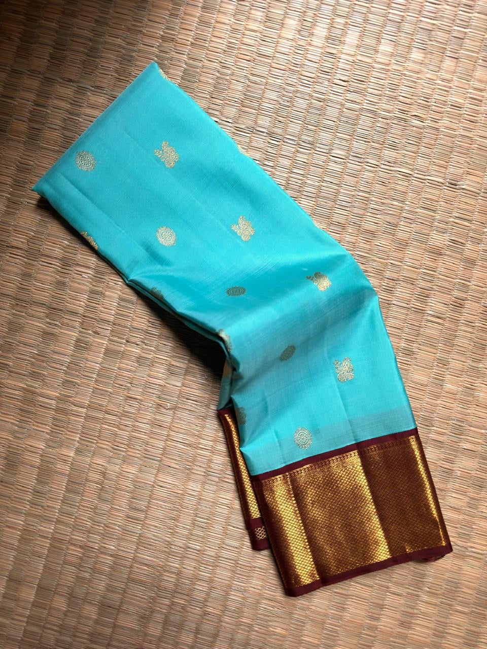 Aqua Blue Pure Silk Kanchipuram Korvai saree with Chocolate Brown Gatti zari border.