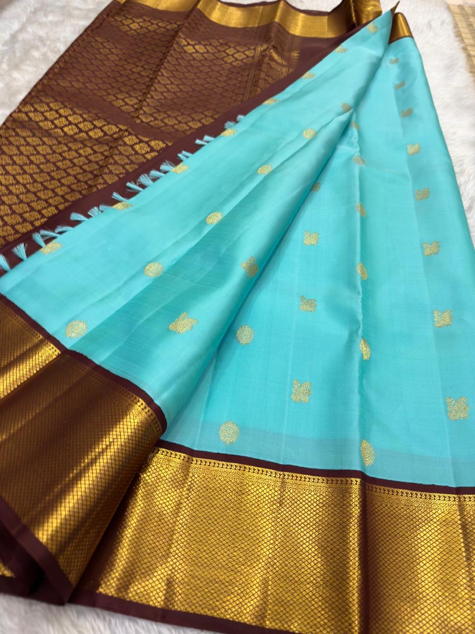 Aqua Blue Pure Silk Kanchipuram Korvai saree body with gold-zari buttas.