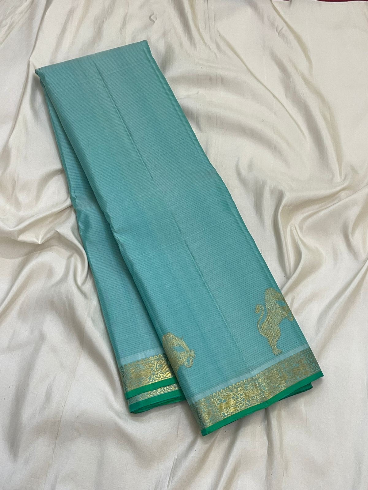Light aqua blue Kanchipuram silk saree with fine continuous Vairaoosi zari lines.