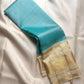 Aqua Blue and Warm Ivory Pure Silk Kanchipuram Zari Kattam saree with intricate metallic zari panels.