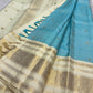 Aqua Blue and Warm Ivory Pure Silk Kanchipuram Zari Kattam saree showing the fine checked zari structure across the aqua silk.