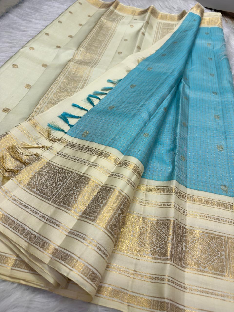 Aqua Blue and Warm Ivory Pure Silk Kanchipuram Zari Kattam saree showing the fine checked zari structure across the aqua silk.