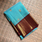 Aqua Blue and Chocolate Brown Kanjivaram silk composition with gold zari.