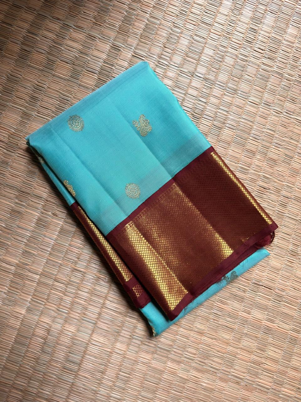 Aqua Blue and Chocolate Brown Kanjivaram silk composition with gold zari.