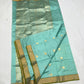 Close-up of the gold-toned border with slender Olive Green edging on an Aqua Blue Katan Silk Chanderi saree