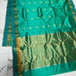 Handloom Turquoise Green Chanderi saree showing antique-gold pallu and gold bird motifs along the body and border