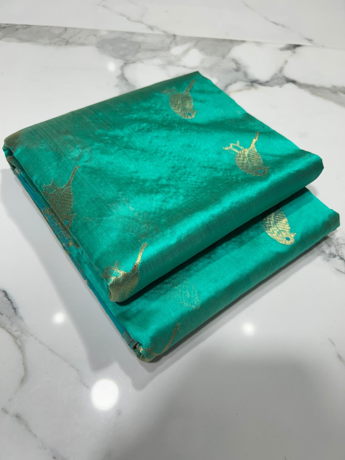 Turquoise Green Pattu Silk Chanderi saree with repeating gold bird motifs, gold border and broad woven pallu