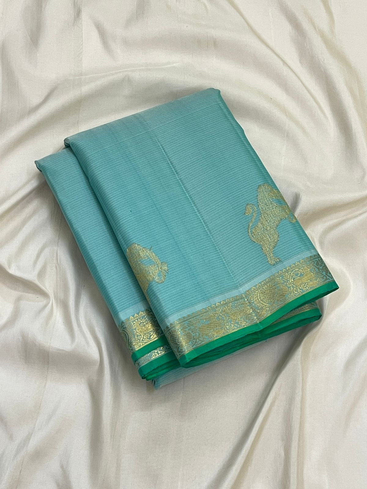 Aqua Blue Vairaoosi saree with delicate gold zari border and fresh green selvedge.