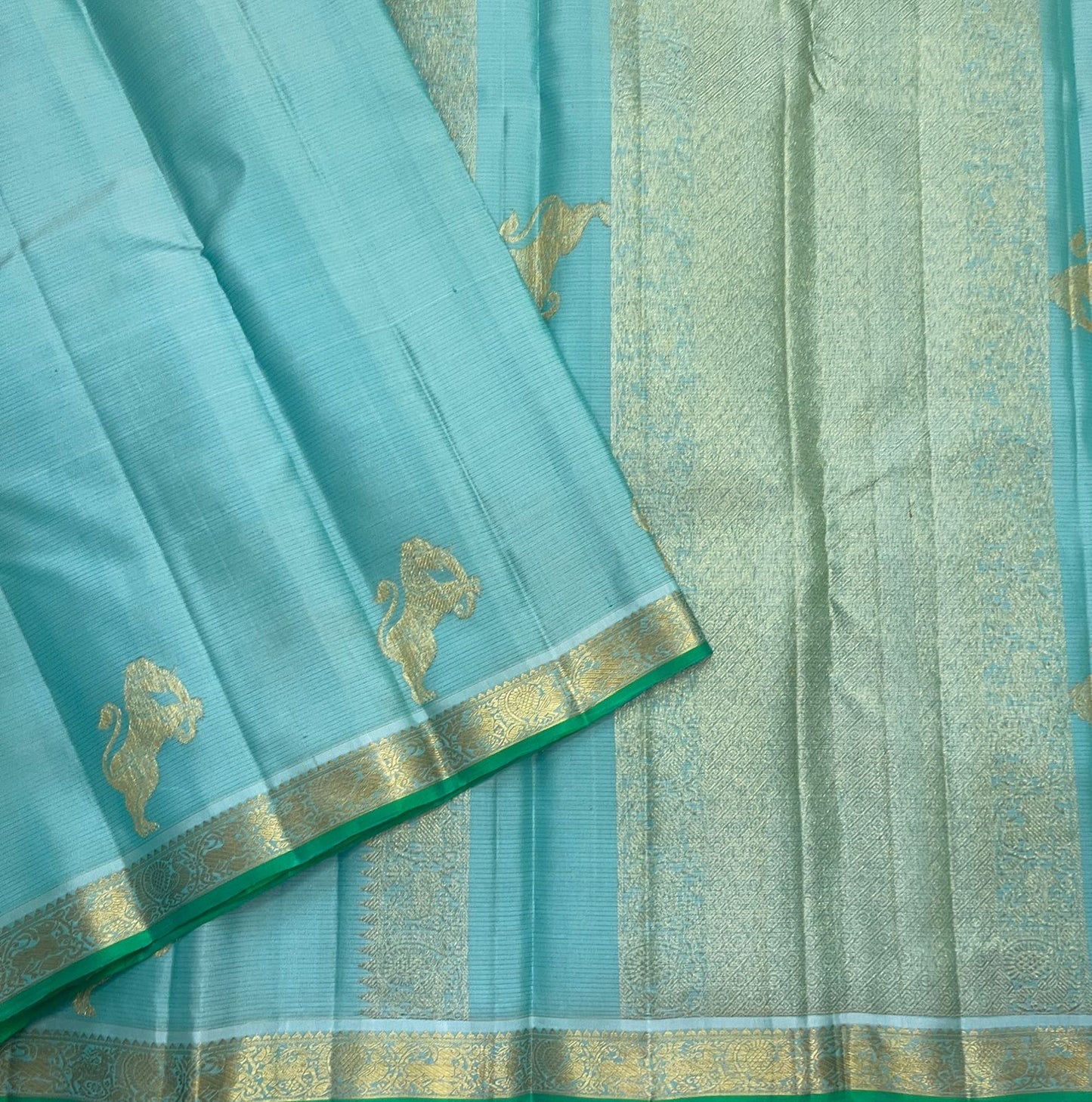 Aqua Ice Blue pure silk Kanjivaram Vairaoosi saree with soft gold zari and green selvedge.