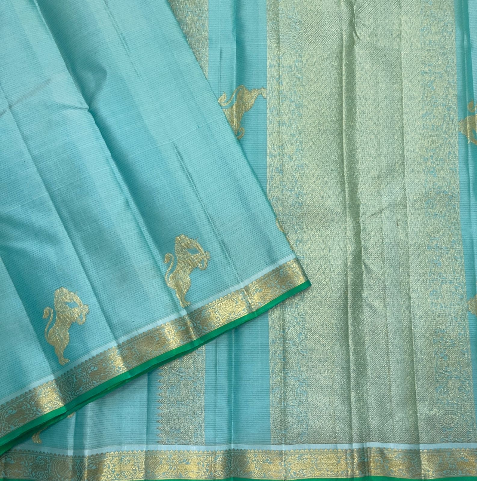 Aqua Ice Blue pure silk Kanjivaram Vairaoosi saree with soft gold zari and green selvedge.