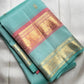 Sea-Glass Aqua Handwoven Pure Silk Kanchipuram Saree with Coral-Rose Rettapet Border and Gold Zari Buttas