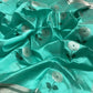 Aqua Turquoise handloom Chanderi silk saree with silver flowers, green leaf accents and luminous silver woven pallu