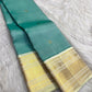 Warm Ivory gold zari traditional motif border on Aqua Teal Kanchipuram saree