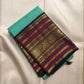 Aqua Turquoise pure silk Kanjipuram Butta saree with deep navy, magenta and gold zari border.