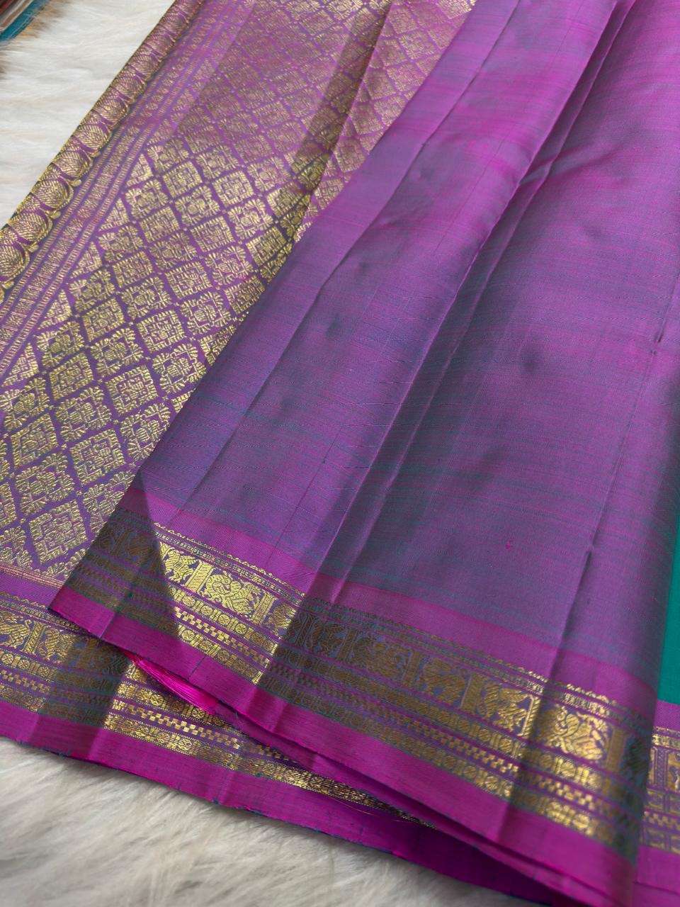 Aqua Turquoise pure silk Kanchipuram saree with antique-gold woven detailing.