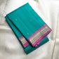 Rani Pink contrast border in antique gold on Aqua Turquoise Kanjivaram saree.