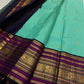 Aqua Turquoise silk body with individually woven gold zari Mayil peacock buttas.