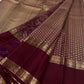 Close view of the Rettapet border with alternating maanga paisleys and circular poo medallions in gold zari.