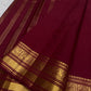 Arakku Kanjeevaram saree with broad gold Pettu, geometric Kattam and floral medallion bands