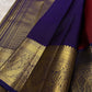Kathiripoo purple border with luminous gold zari and oversized paisley medallions