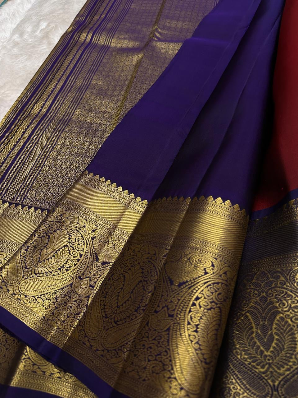 Kathiripoo purple border with luminous gold zari and oversized paisley medallions