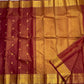 Detail of the Maanga zari border on the Arakku maroon Kanchipuram silk saree