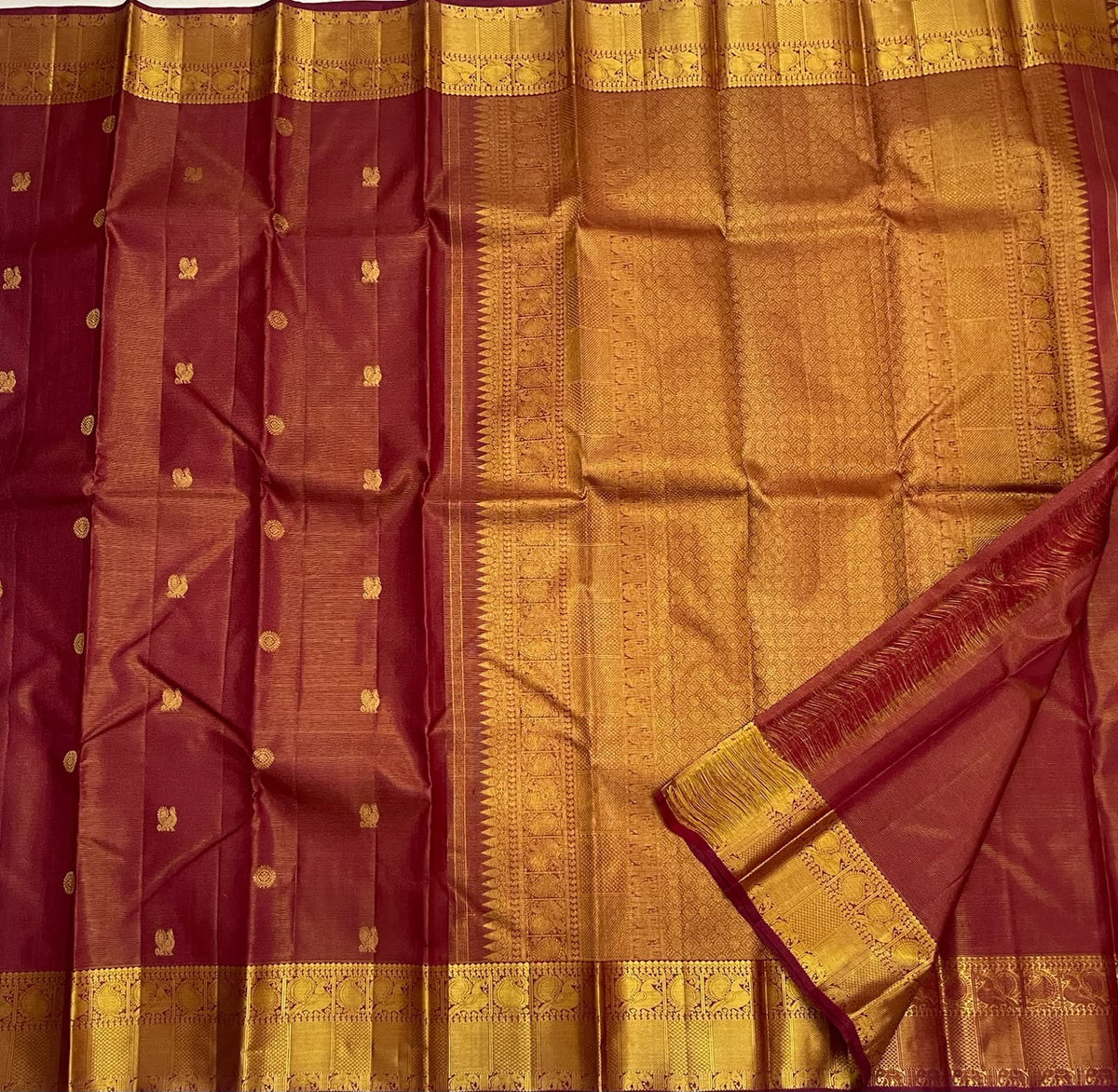 Detail of the Maanga zari border on the Arakku maroon Kanchipuram silk saree