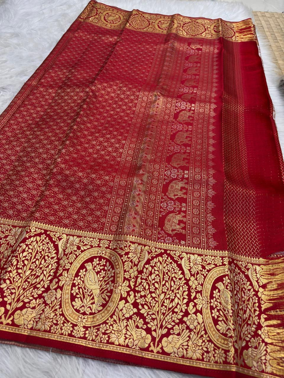 Broad Arakku Red Kanjivaram border densely woven with gold birds, flowers, foliage and oval medallions.