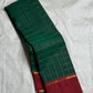 Close view of the Arakku Red border with narrow gold zari bands and green finishing edge