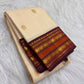 Arakku red border detail, warm-ivory Kanjivaram Korvai saree