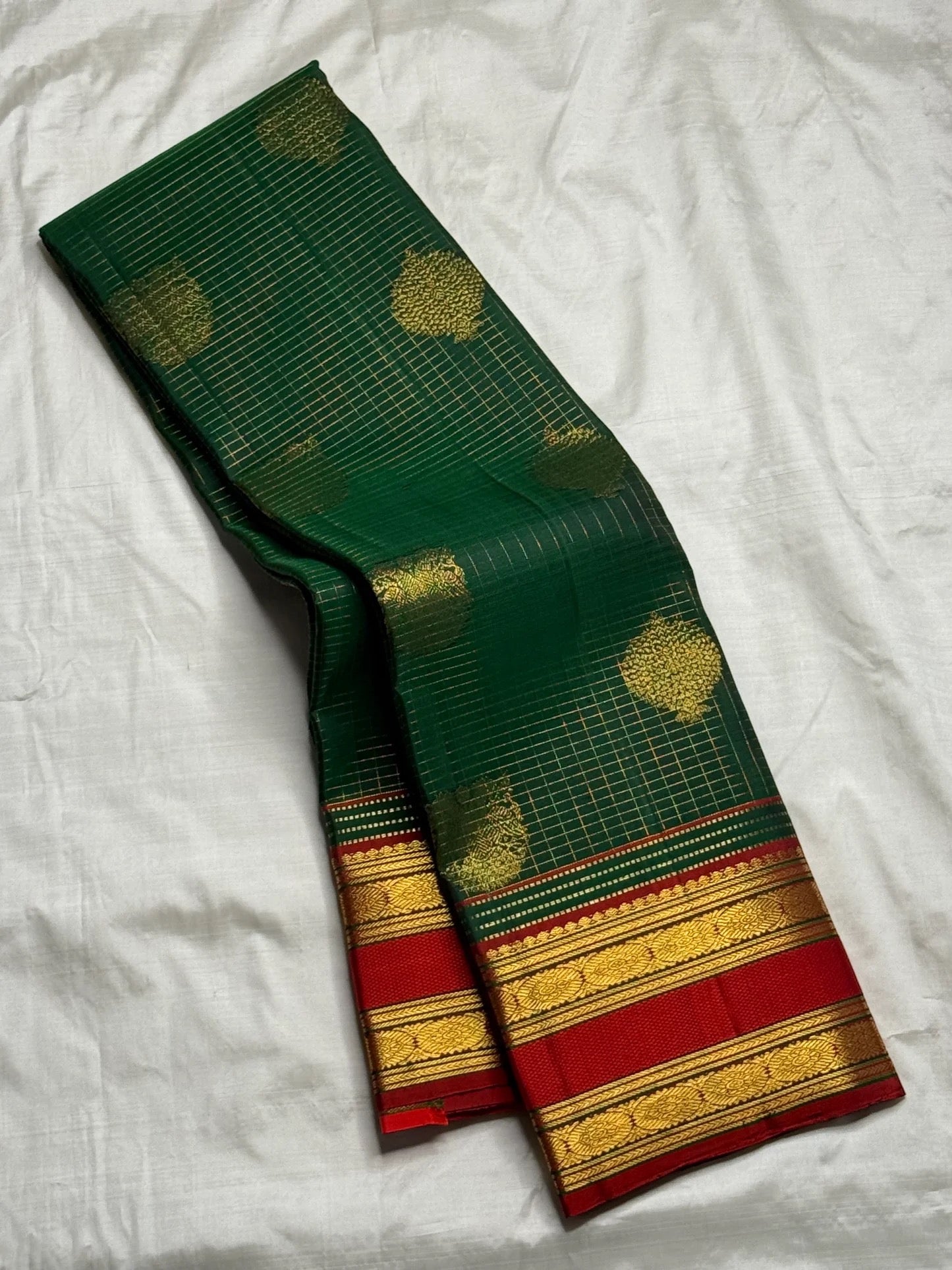 Handwoven bottle green pure silk Kanjivaram saree with gandaberunda motif and arakku red border — Idam Living