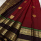 Dense gold zari pallu on the arakku red Kanjivaram rettapet saree.