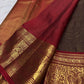 Arakku Red Kanchipuram pallu with dense geometric gold zari field and intricate ceremonial woven detailing.