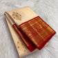 Arakku red Kanjivaram border with broad gold zari floral scrolls beside the warm ivory body.