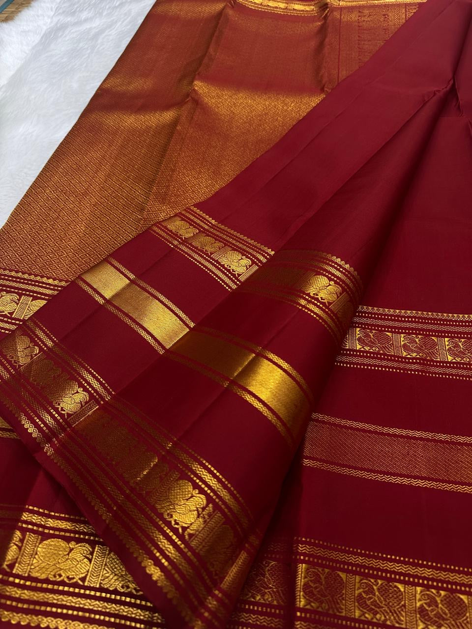 Arakku Red pure silk Kanchipuram body with spaced gold zari buttas