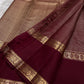 Arakku red silk body showing close rhythmic rows of tiny traditional gold zari flower buttas across the field.