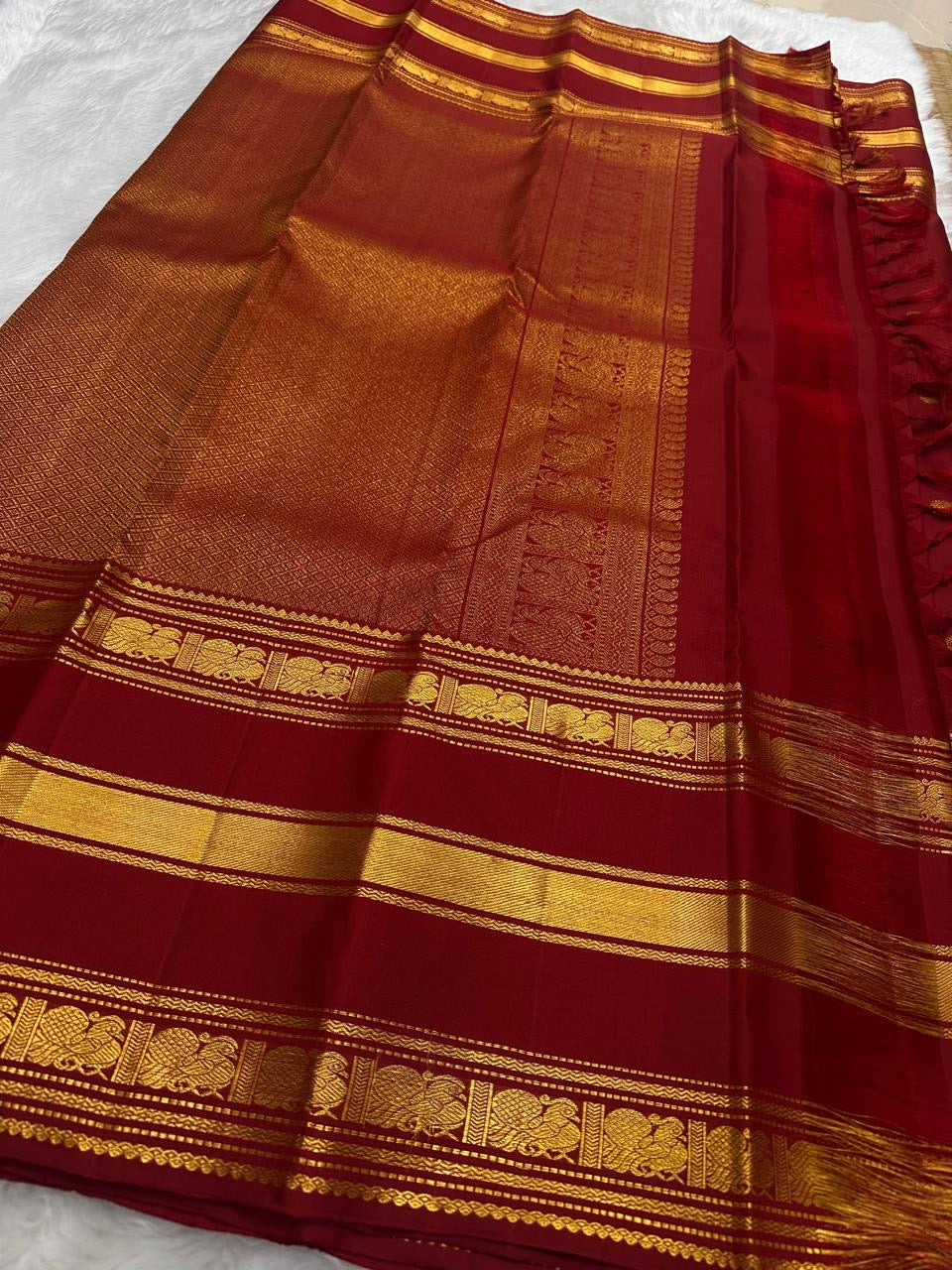 Full view of the Arakku Red Handwoven Pure Silk Kanchipuram Varisaipet Saree with Yaanai Gold Zari Border