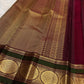 Handwoven red Kanjivaram saree with Deep Aubergine and Peacock Green contrast border