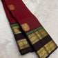 Handwoven pure silk Kanjivaram rettapet saree in arakku red with larger gold buttas and a coffee-brown contrast border.