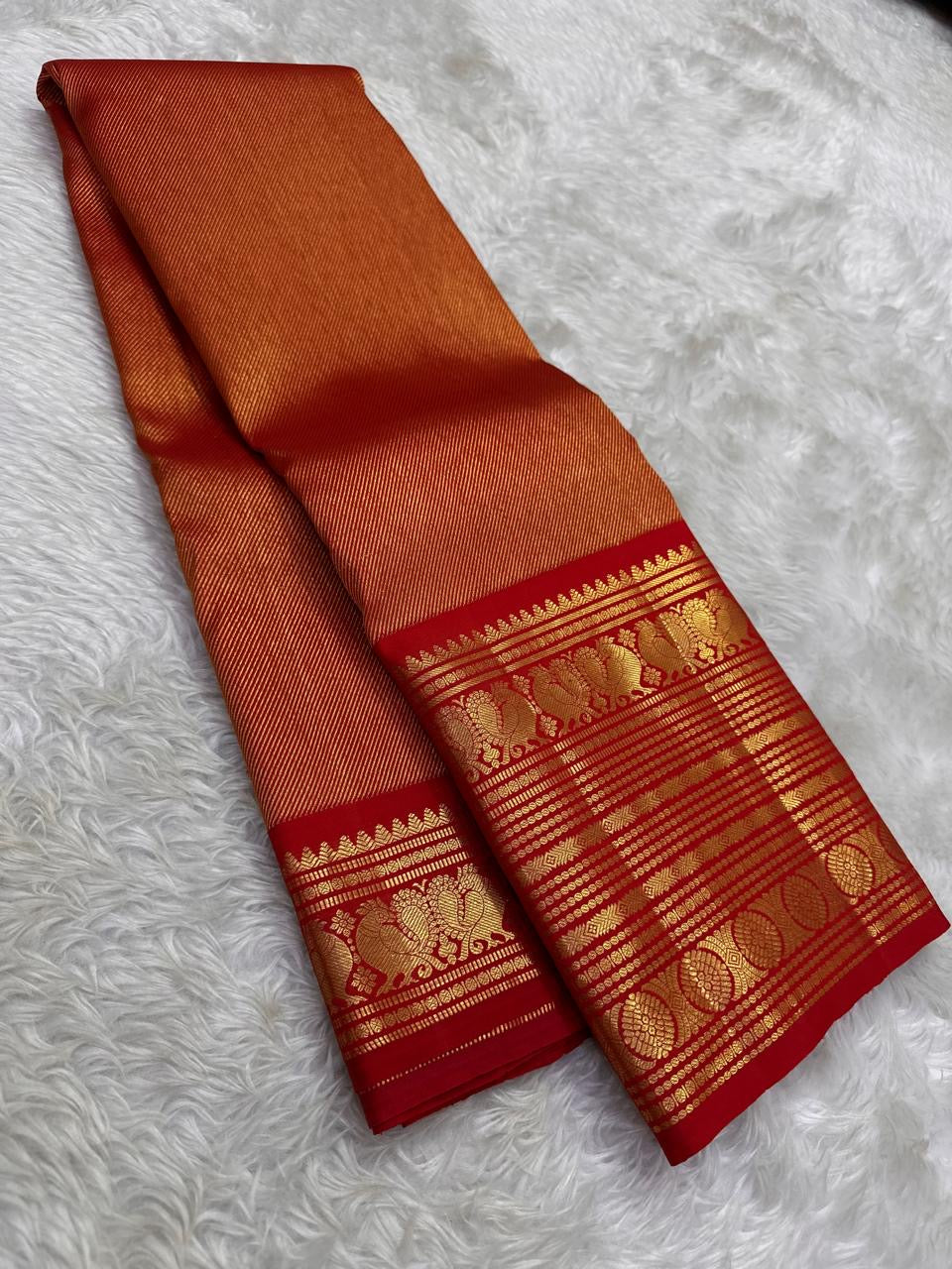 Handwoven pure silk Kanjipuram saree in rust orange with Korvai Vairaoosi diagonal zari stripe body and arakku red Korvai Yaanai Annam antique gold zari border Silk Mark certified