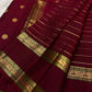 Vintage-style Deep Arakku Red Rettapet saree with traditional Mayil gold zari border.