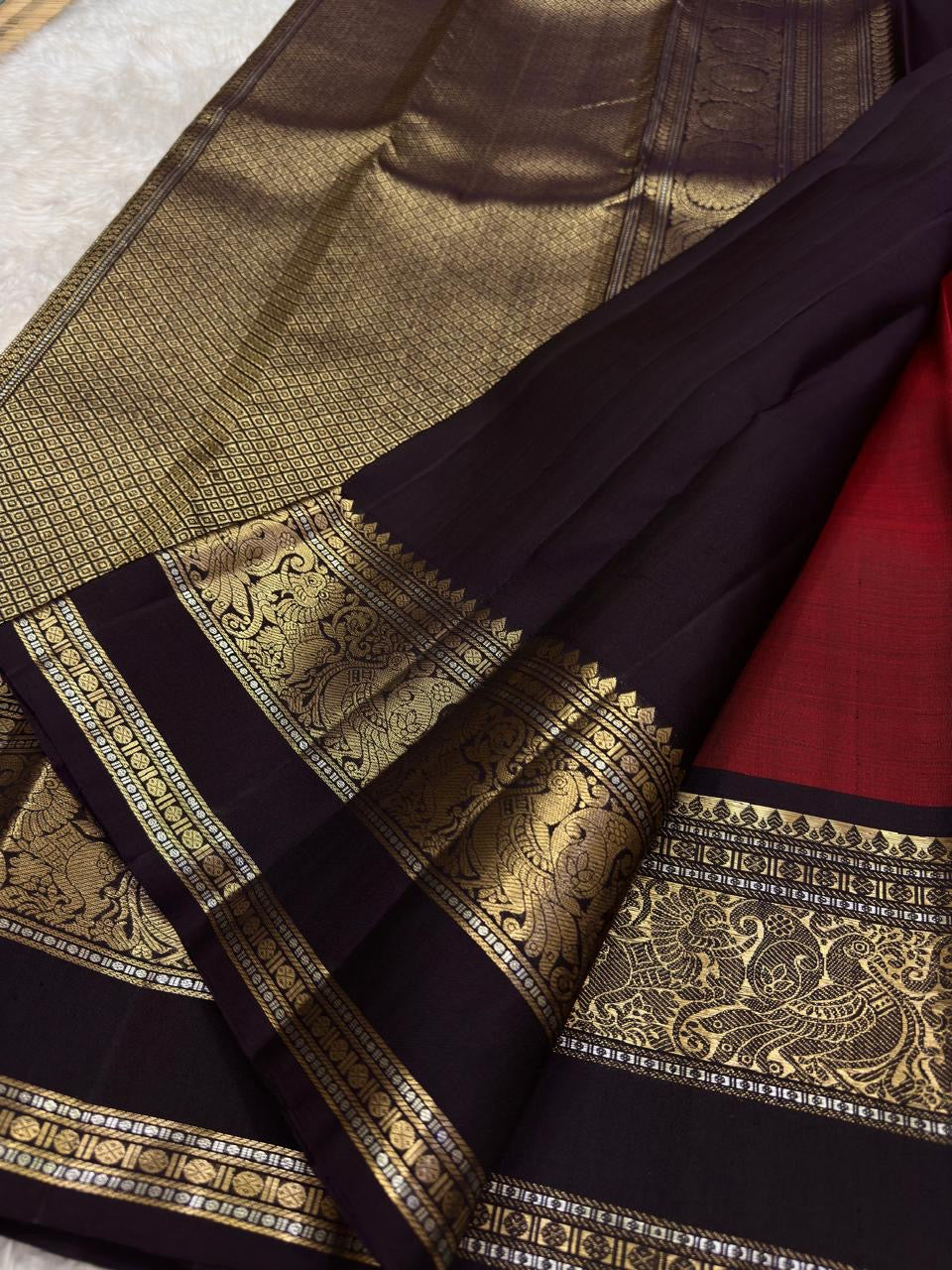 Arakku Red and Deep Maroon Handwoven Pure Silk Kanjeevaram Saree with Mayil Butta and Vanasringaram Silk Thread Border