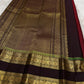 Border detail showing slim green highlight bands and gold zari.