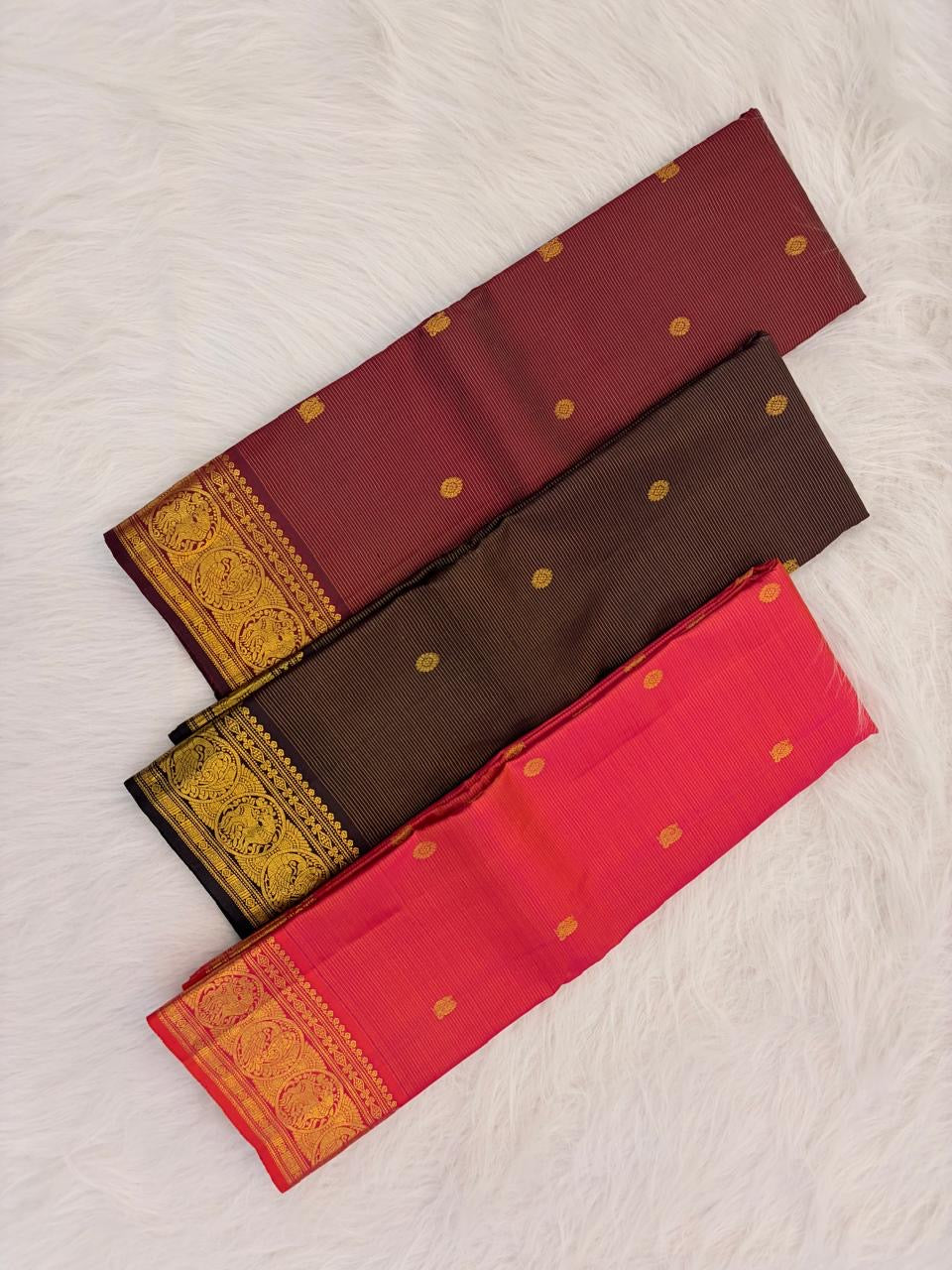 Ornate self-colour Mayil peacock border of tomato red pink shot colour Kancheepuram saree with dense antique gold zari bands