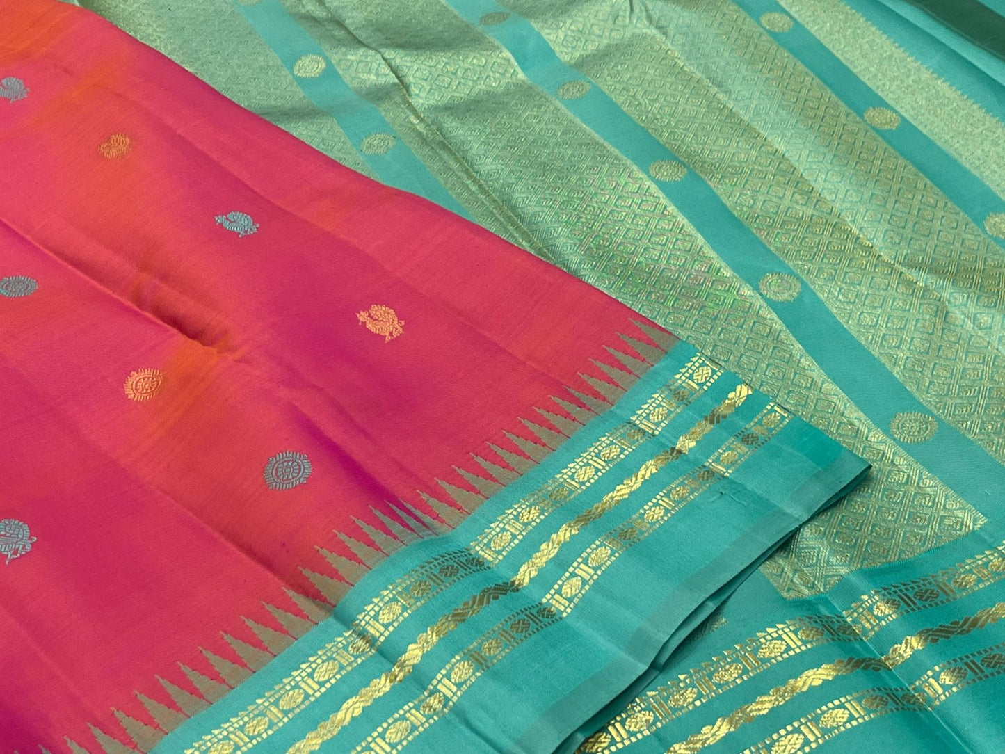 Handwoven pure silk Kancheepuram shot colour tomato red pink saree with Mayil Chakram buttas and teal Korvai border Silk Mark certified