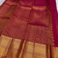 Folded view of arakku red pure silk Kanjeevaram saree with Zari Kattam Gandaberunda Butta